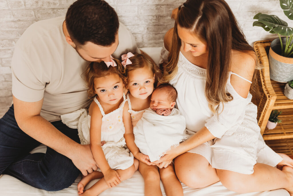 Family of five with newborn baby