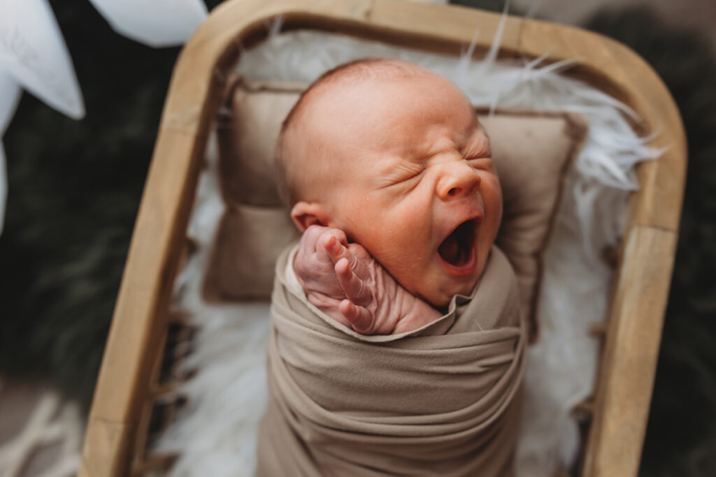newborn baby boy yawning in Harrisburg riverfront studio
