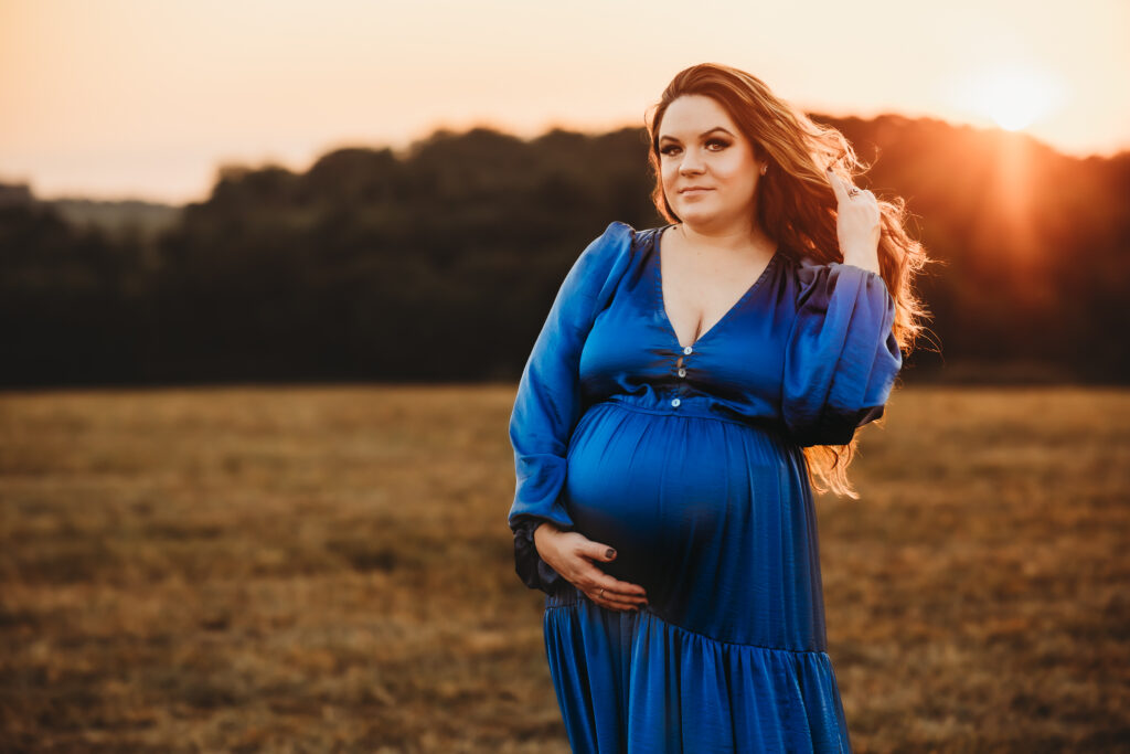 Pregnant mom in blue dress at golden hour in Harrisburg, PA 