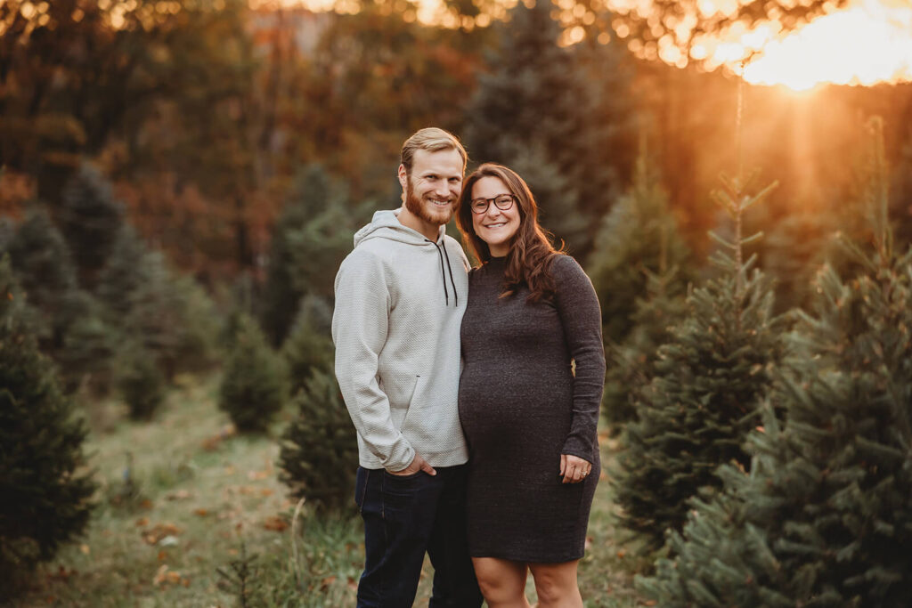 Expecting mom and dad at a Christmas Tree Farm around Harrisburg 