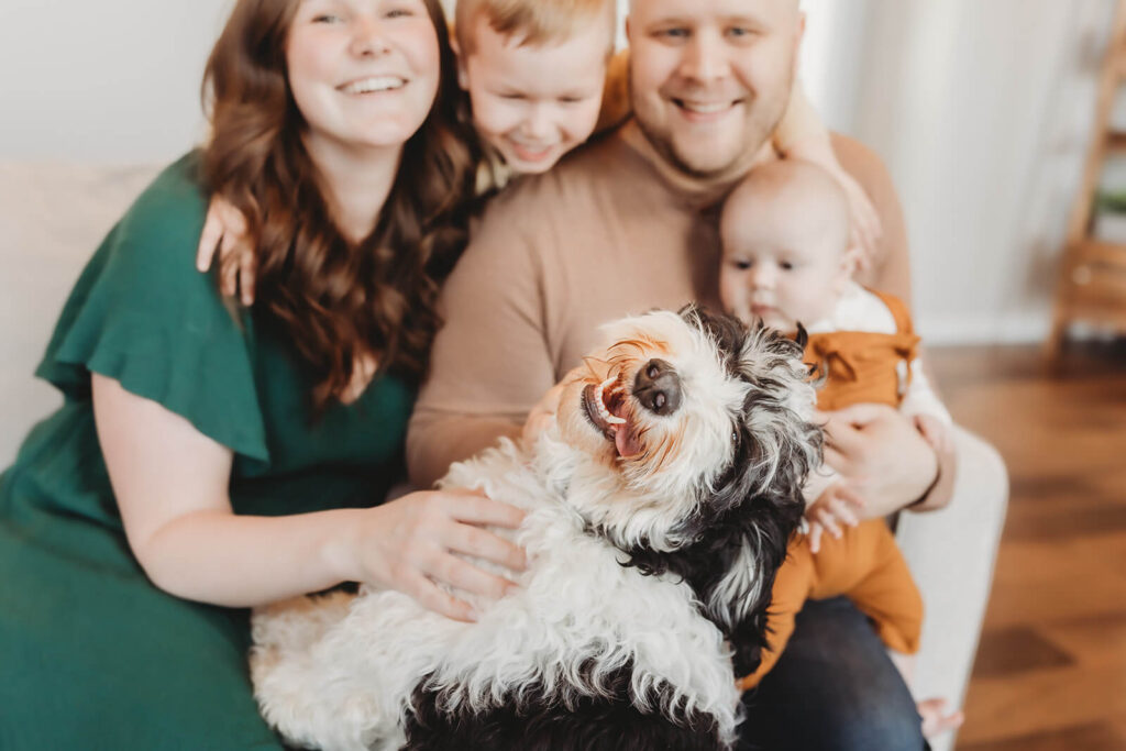 smiling dog with family 
