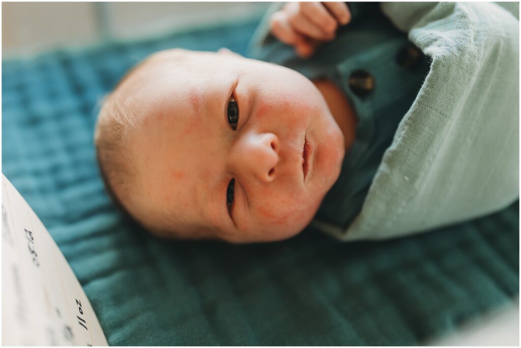 baby boy in teal in hospital newborn photos
