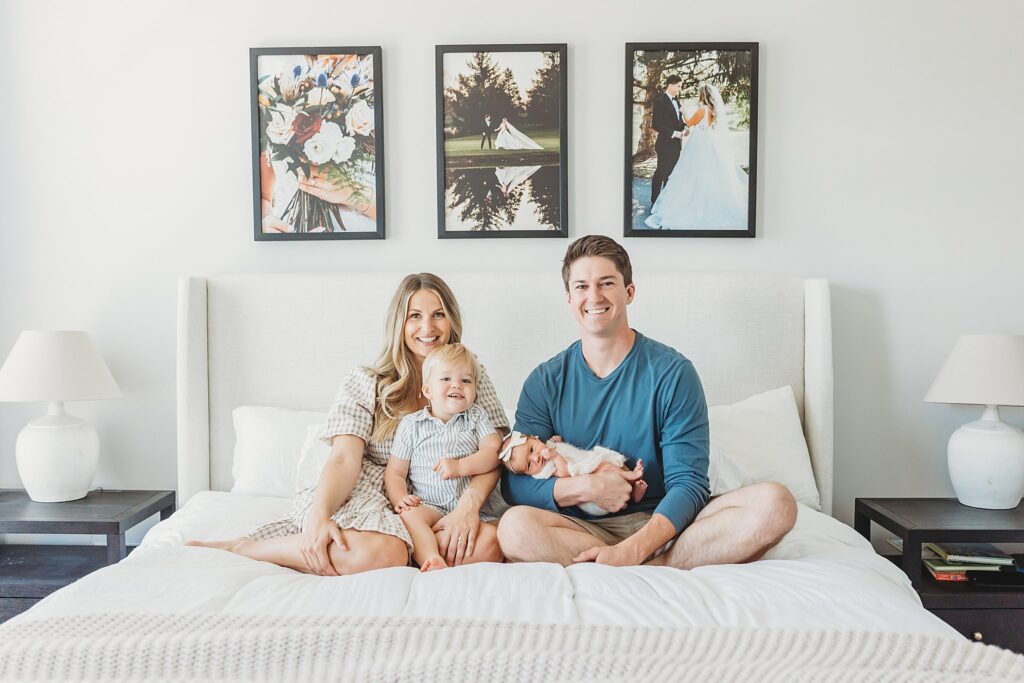 Family photo on their bed taken by Mechanicsburg newborn photographer