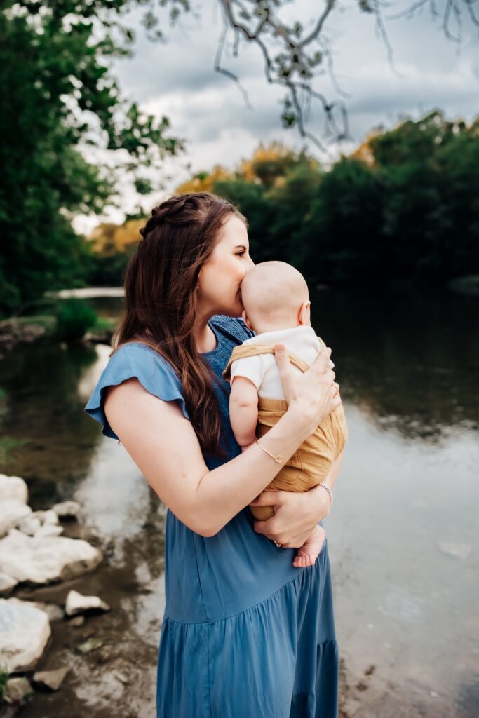 Mama snuggling with her baby boy near a creek in york,Pa