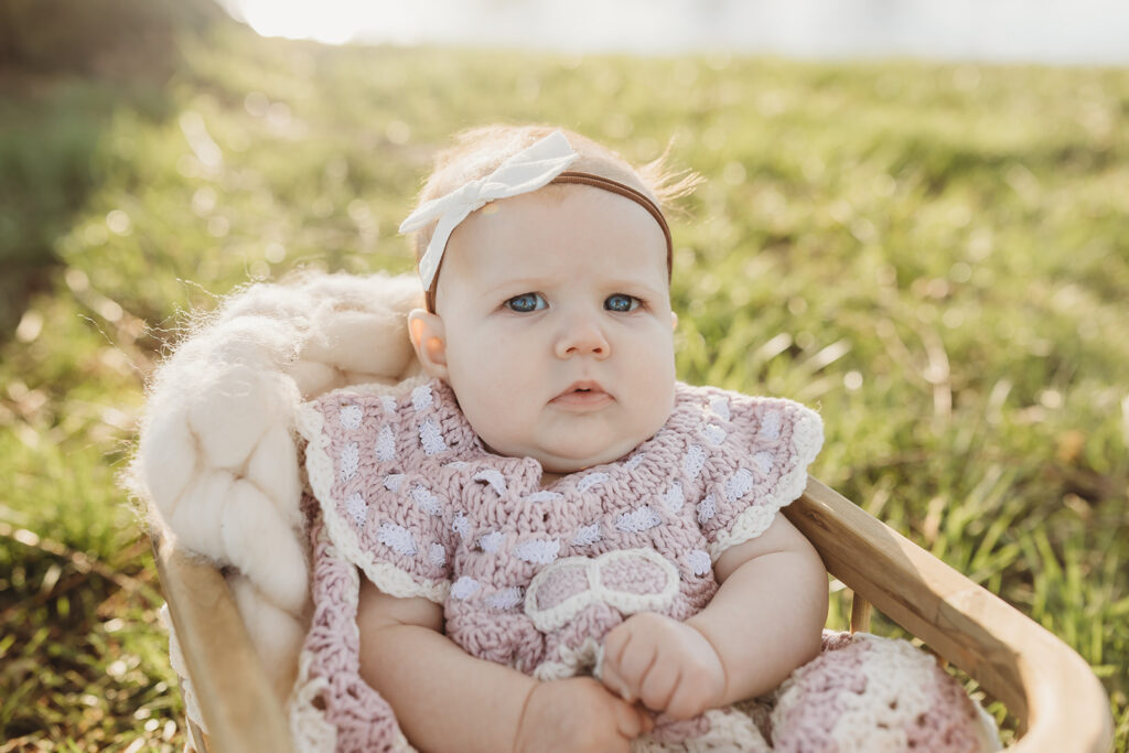 Sweet baby girl in a handmade outfit during her York milestone session