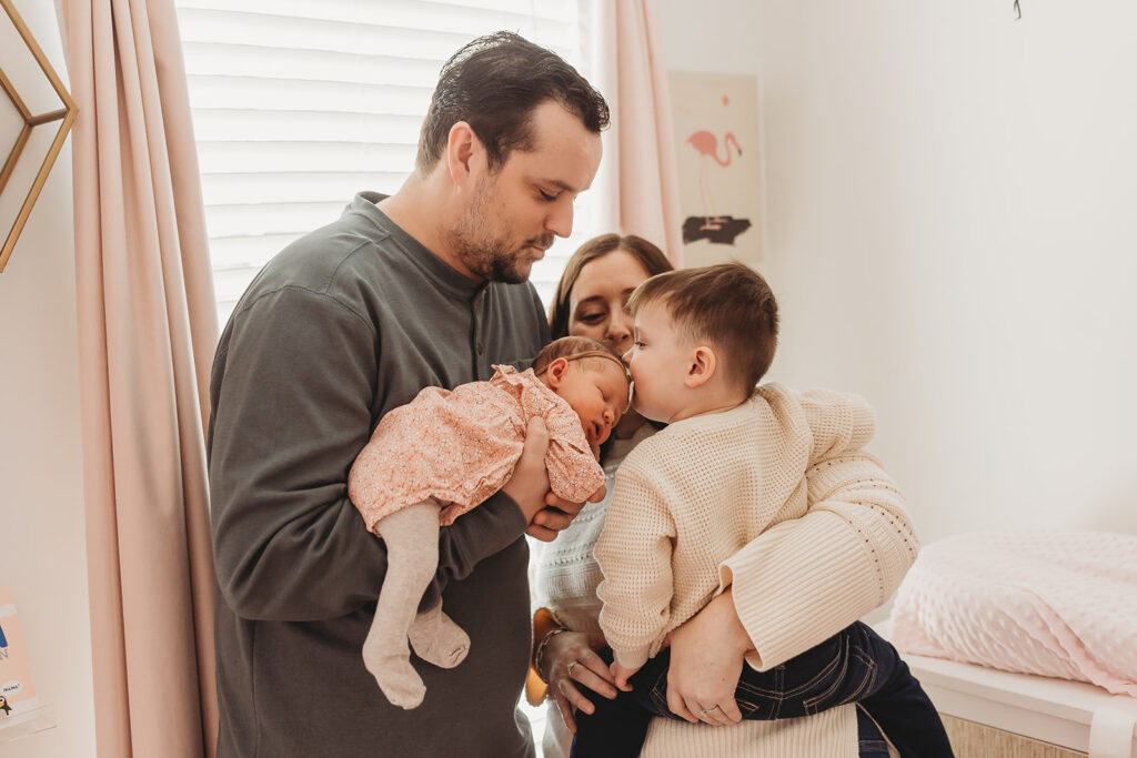 Family love - family snuggles together during their in home newborn session