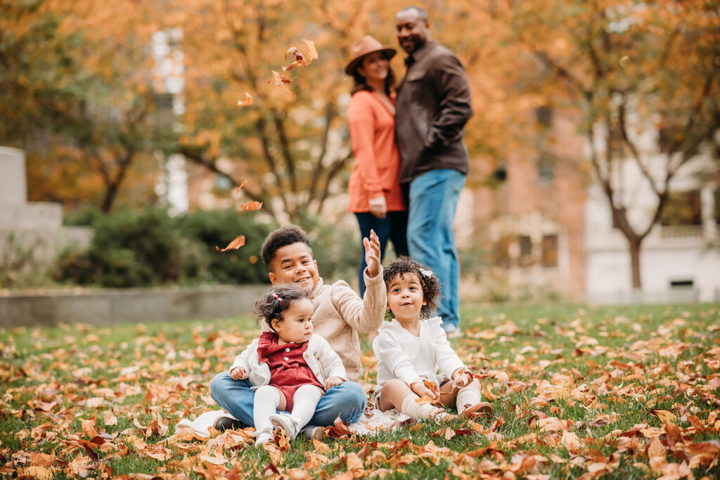 Family of 5 throws leaves together during their family session in Harrisburg, PA 