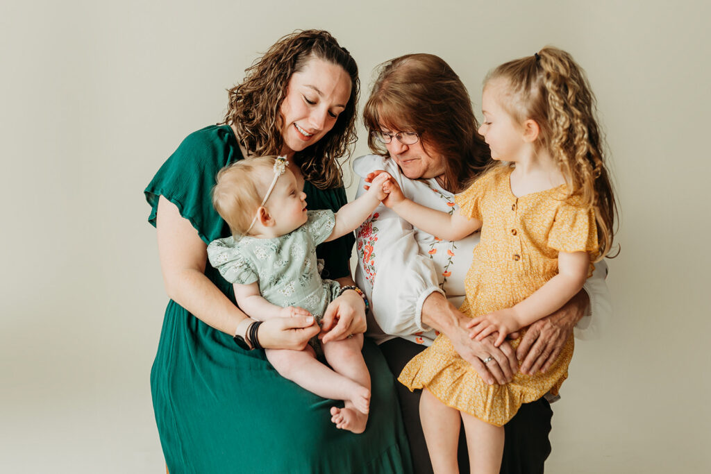 Studio session with Kate McCord Photography with multigenerational photo of mom, daughter, and grandchildren