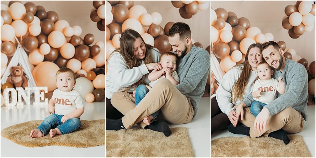 First birthday boy Leo poses on his cake smash set with his mom and dad before we present him with his cake to smash! 