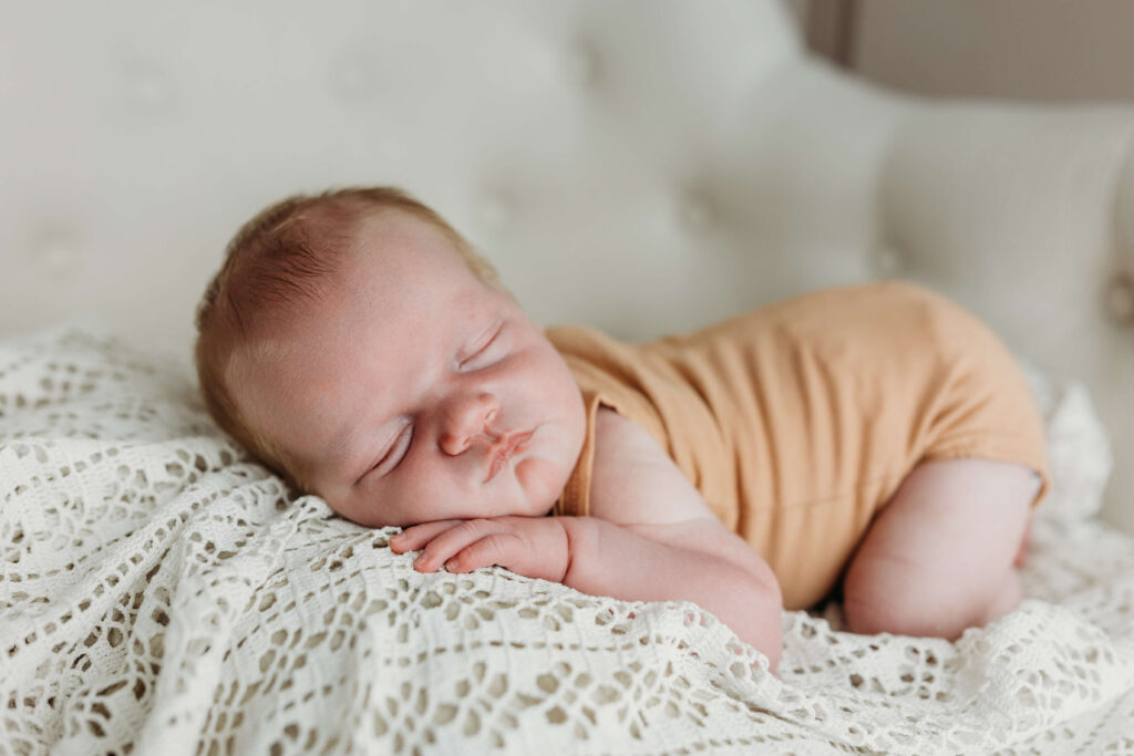 Baby sleeping on his tummy supervised