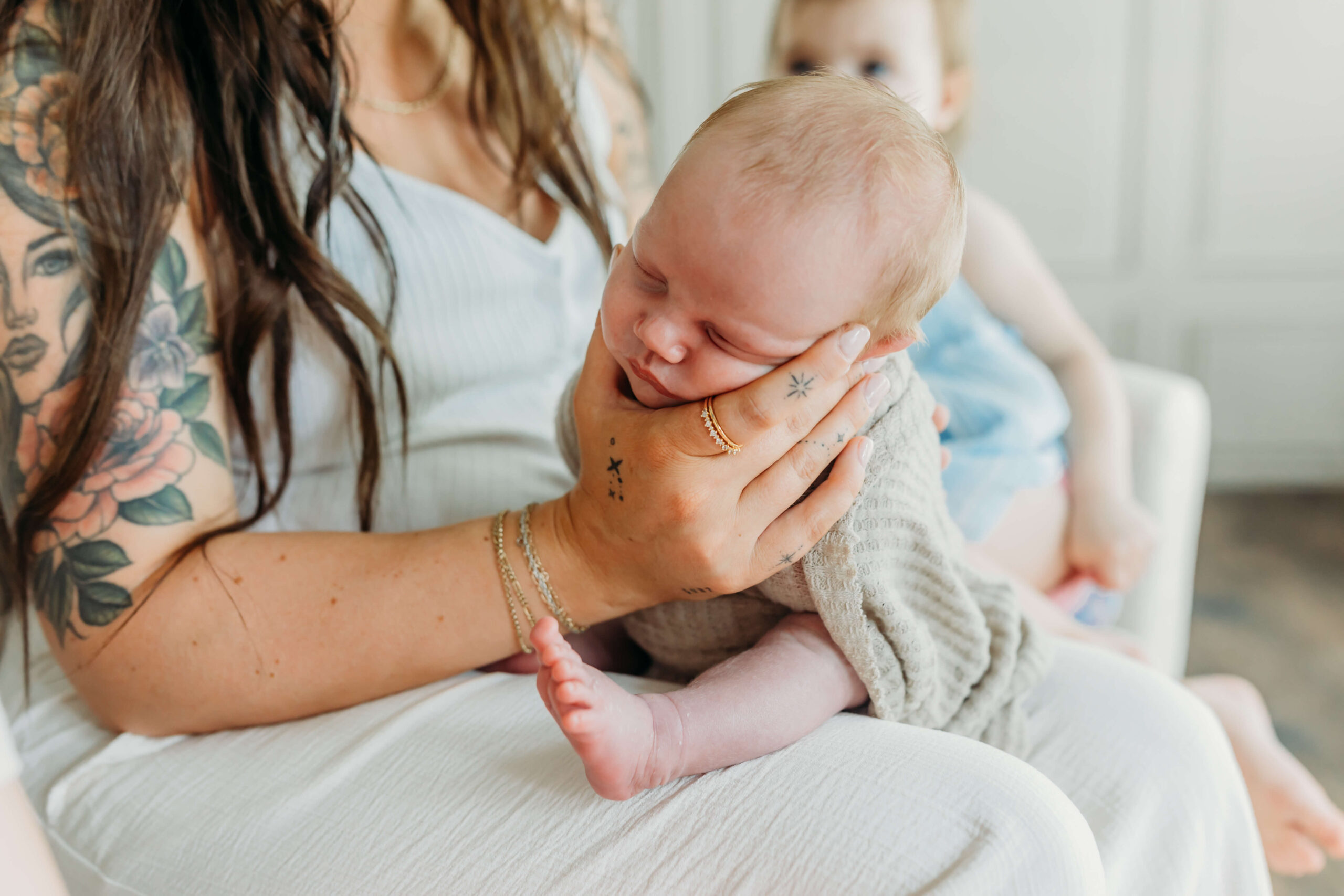 Baby being held up right to soothe colic symptoms