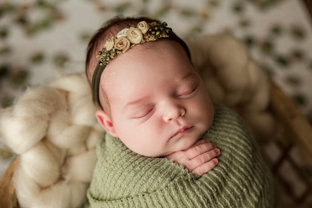 Studio newborn photo near York PA baby wrapped in neutral tones