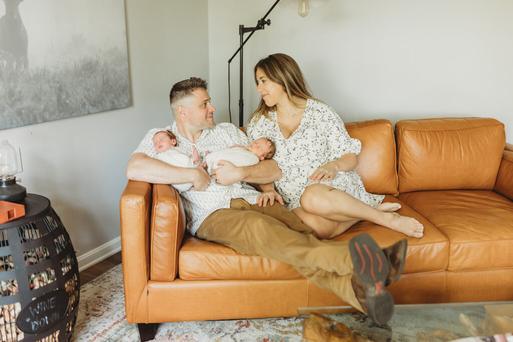 York PA newborn photographer family cuddling newborn in soft natural light