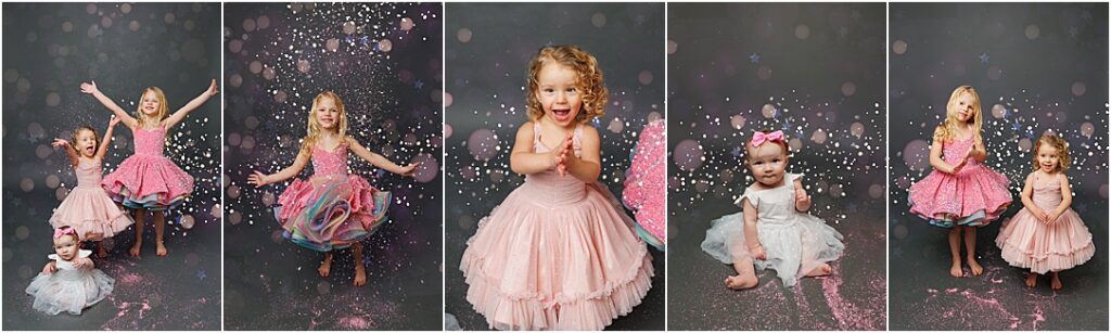 A collage of young girls in sparkly, pastel dresses playing with glitter in a studio. Some are twirling as glitter falls around them, others are clapping or tossing glitter into the air. One baby in a white dress with a pink bow sits amid scattered sparkles. The backdrop is dark with soft bokeh-style lights, creating a magical, whimsical atmosphere.