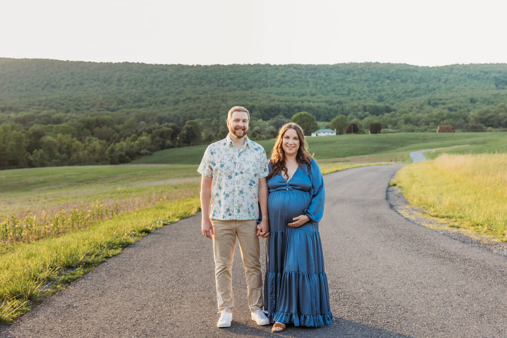 Expecting couple walking together during maternity session