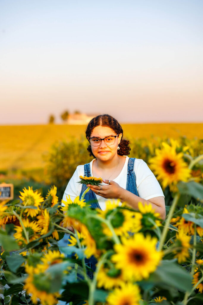 Class of 2027 senior photographed among sunflower fields and farmland at Royal Oaks Farm in Lebanon PA
