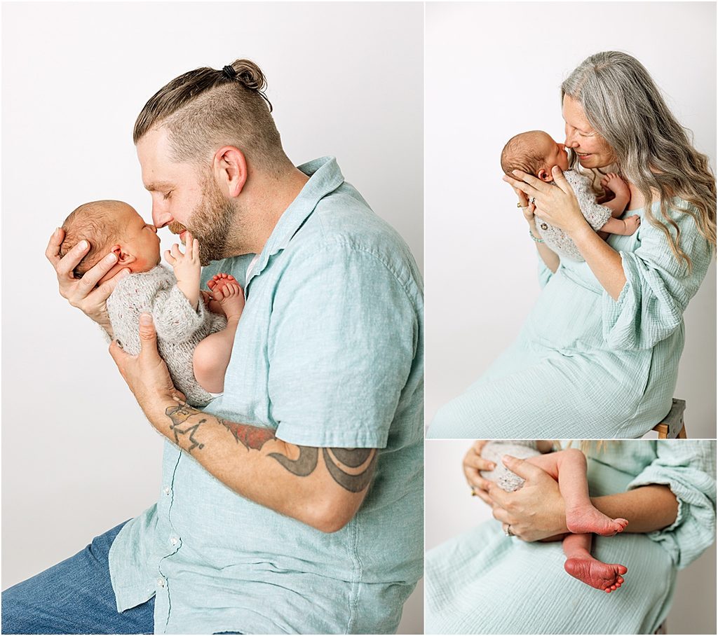 Mother and father cuddling and interacting with their newborn baby during natural studio family portraits.